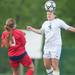 Father Gabriel Richard's Hadley Yoas head buts the ball during the first half of the regional semifinal game against Hanover-Horton, Wednesday, May 29.
Courtney Sacco I AnnArbor.com  